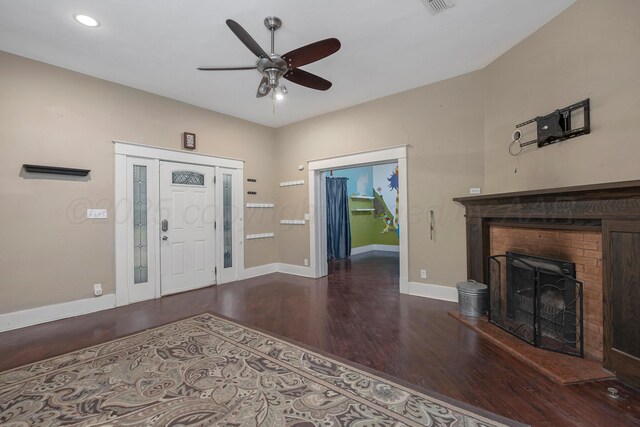 1717 S Tyler St, Amarillo, TX 79102 - entrance foyer featuring wood finished floors, a ceiling fan, a brick fireplace, and recessed lighting