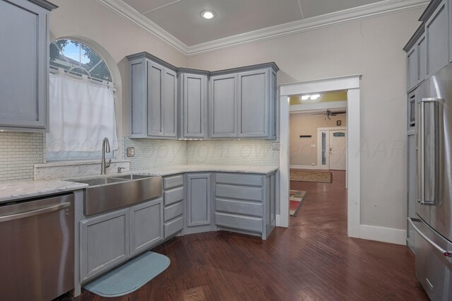 1717 S Tyler St, Amarillo, TX 79102 - kitchen featuring appliances with stainless steel finishes, gray cabinets, crown molding, light stone countertops, and tasteful backsplash