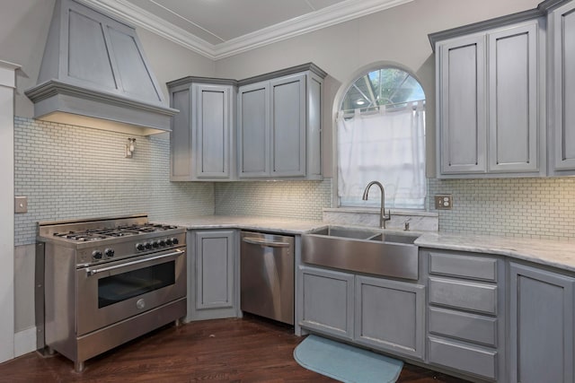 1717 S Tyler St, Amarillo, TX 79102 - kitchen with stainless steel appliances, gray cabinets, custom range hood, tasteful backsplash, and ornamental molding