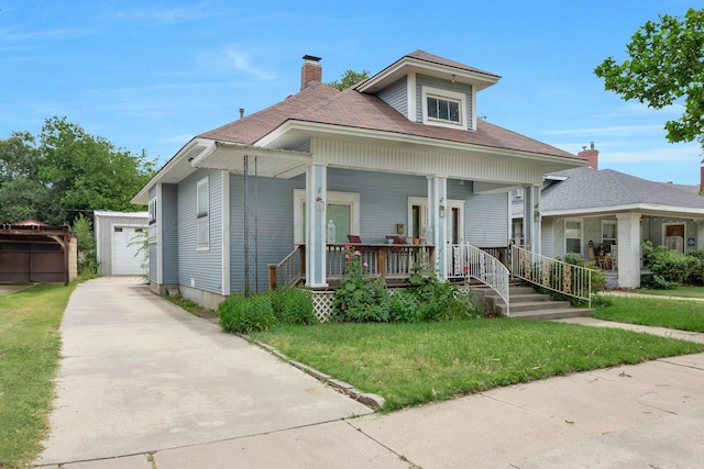 1717 S Tyler St, Amarillo, TX 79102 - bungalow-style house featuring an outbuilding, covered porch, a front yard, a chimney, and a shingled roof
