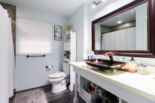 bathroom with toilet and vanity