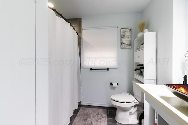 full bath with tile patterned flooring, toilet, and vanity
