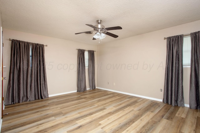 3729 Wayne St, Amarillo, TX 79109 - unfurnished room with light wood-style floors, a ceiling fan, and a textured ceiling
