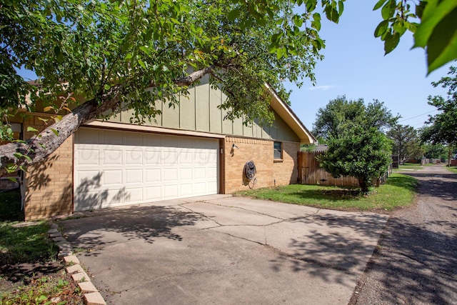 3729 Wayne St, Amarillo, TX 79109 - view of home's exterior with brick siding, concrete driveway, and board and batten siding