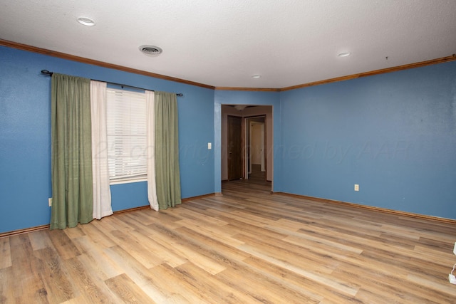 3729 Wayne St, Amarillo, TX 79109 - spare room with light wood-style flooring, crown molding, recessed lighting, and a textured ceiling
