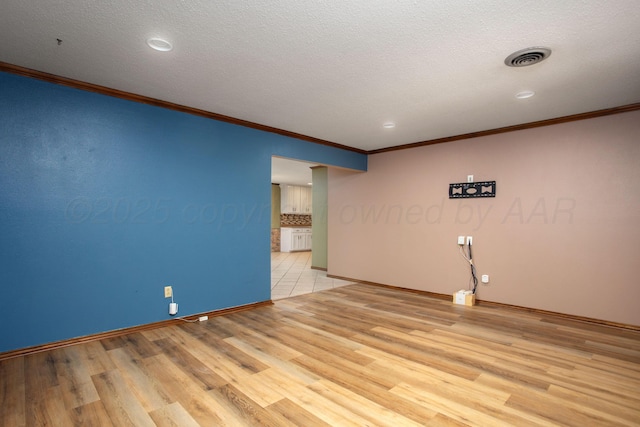 3729 Wayne St, Amarillo, TX 79109 - empty room with ornamental molding, light wood-style floors, a textured ceiling, and recessed lighting