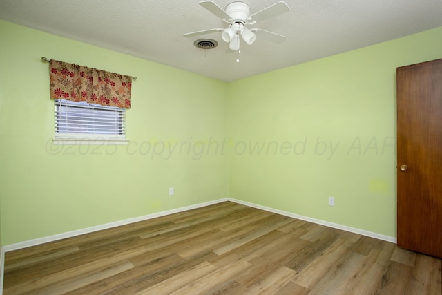 3729 Wayne St, Amarillo, TX 79109 - spare room with wood finished floors, a ceiling fan, and a textured ceiling