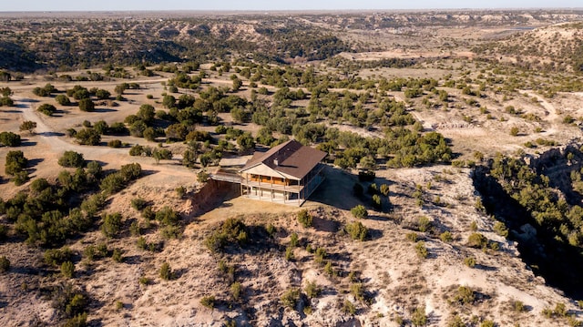 aerial view featuring a desert view and a rural view