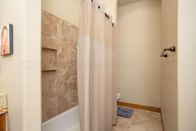 full bathroom featuring toilet, tile patterned flooring, and shower / tub combo with curtain