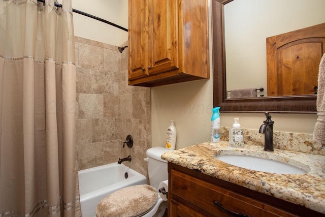 full bath featuring vanity, toilet, and shower / tub combo