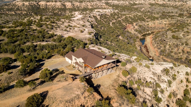 birds eye view of property with a rural view
