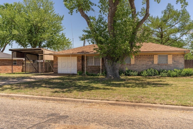 ranch-style home featuring a front yard, brick siding, driveway, and fence