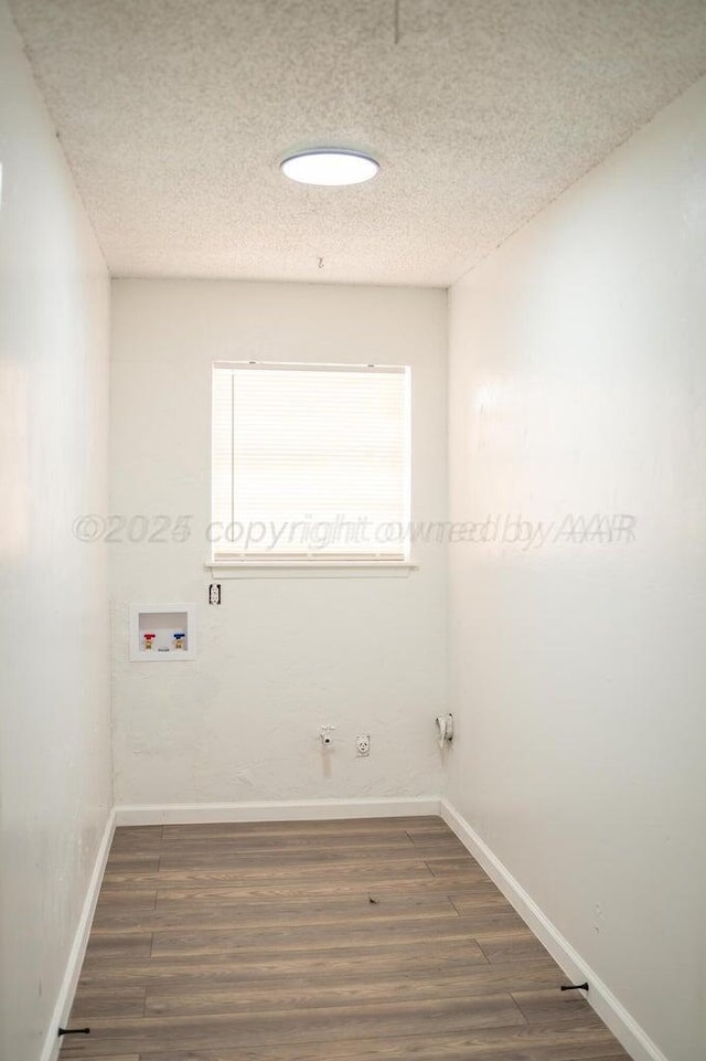 laundry room with a textured ceiling, hookup for a gas dryer, laundry area, washer hookup, and wood finished floors