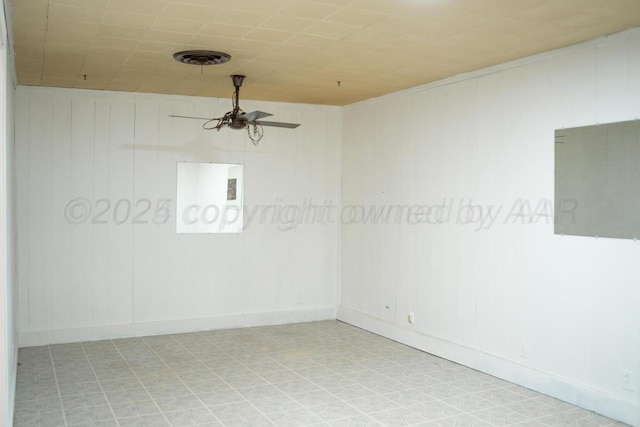 spare room featuring ceiling fan and visible vents