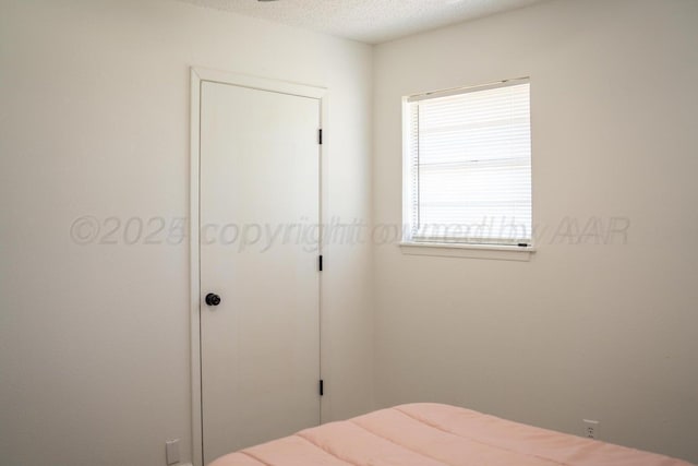 bedroom with a textured ceiling