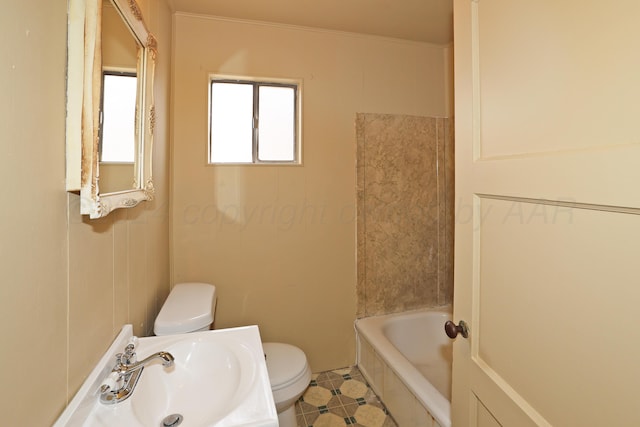 bathroom with tile patterned floors, a washtub, sink, and toilet