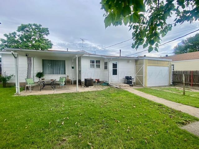 928 Elmore St, Borger, TX 79007 - back of house with a patio area and an attached garage