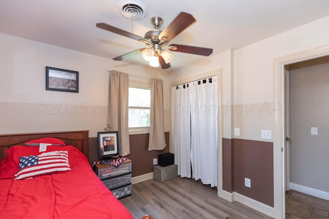 2711 Mohawk Dr, Amarillo, TX 79109 - bedroom featuring baseboards, wood finished floors, and a ceiling fan