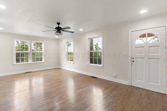 3201 S Grand St, Amarillo, TX 79103 - entrance foyer with plenty of natural light, crown molding, wood finished floors, ceiling fan, and recessed lighting