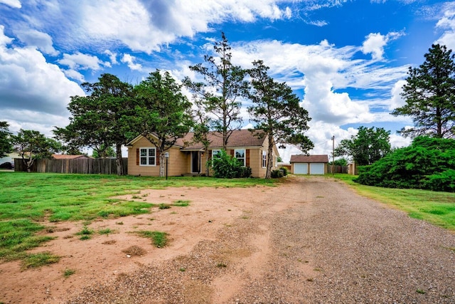 3201 S Grand St, Amarillo, TX 79103 - ranch-style home with an outbuilding, dirt driveway, and a detached garage
