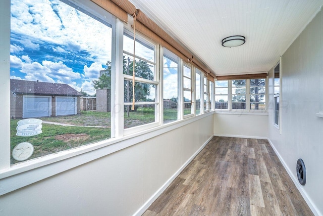 3201 S Grand St, Amarillo, TX 79103 - unfurnished sunroom with wood finished floors and baseboards