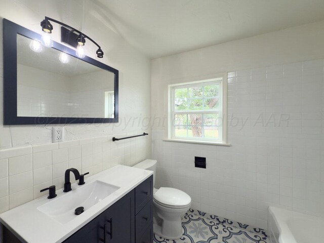 3201 S Grand St, Amarillo, TX 79103 - full bathroom featuring tile walls, vanity, a bath, and tile patterned floors