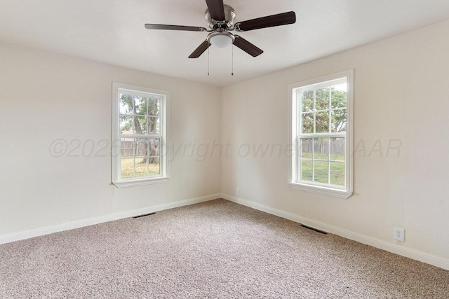 3201 S Grand St, Amarillo, TX 79103 - carpeted empty room with plenty of natural light and a ceiling fan