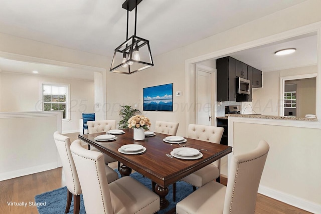 3201 S Grand St, Amarillo, TX 79103 - dining area featuring wood finished floors and baseboards