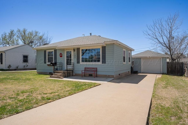 view of front of home featuring an outbuilding, concrete driveway, fence, crawl space, and a front yard