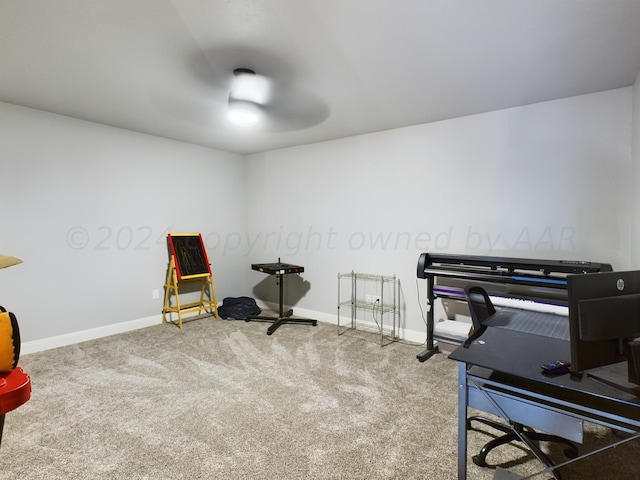 misc room with carpet floors, baseboards, and ceiling fan
