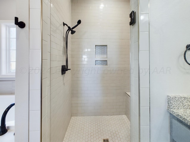full bath featuring a stall shower and vanity