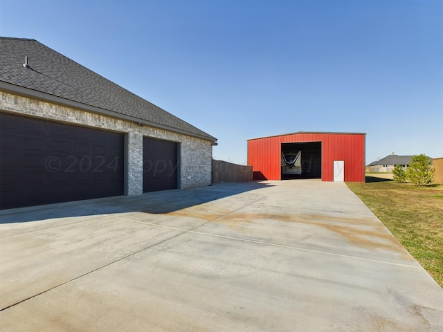 garage with concrete driveway