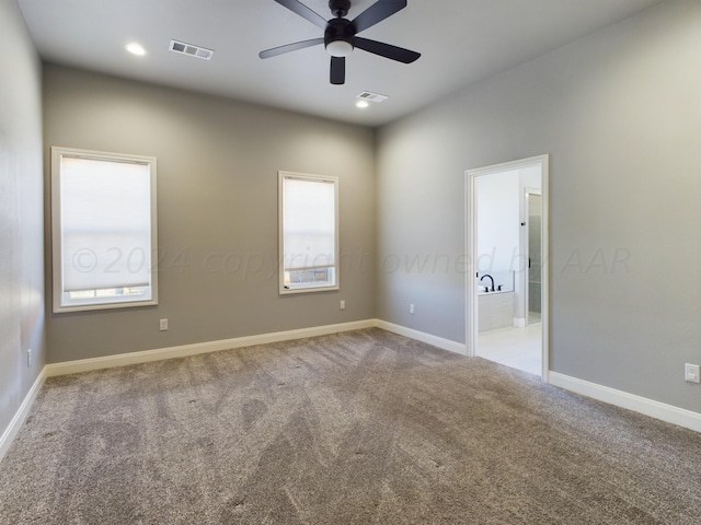 empty room featuring baseboards, recessed lighting, visible vents, ceiling fan, and carpet