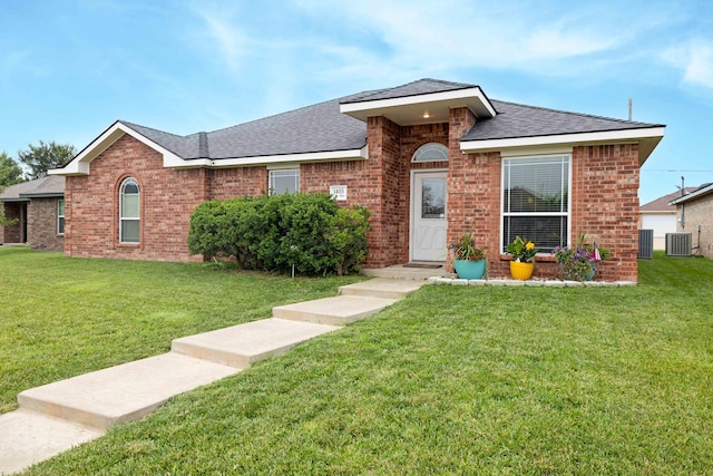 1405 SW 61st Ave, Amarillo, TX 79118 - view of front facade with a front yard, brick siding, and a shingled roof