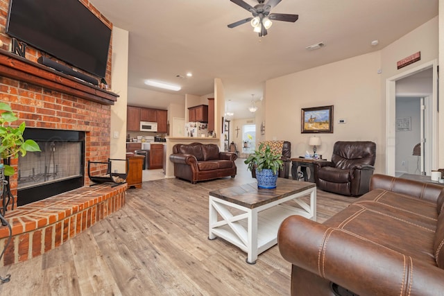 1405 SW 61st Ave, Amarillo, TX 79118 - living area with light wood-style floors, ceiling fan, a fireplace, and recessed lighting