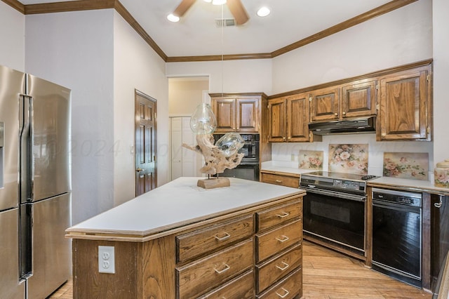 kitchen with light hardwood / wood-style floors, black appliances, ornamental molding, backsplash, and a center island