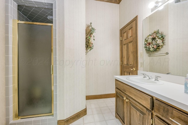 bathroom with vanity, tile patterned floors, and a shower with shower door