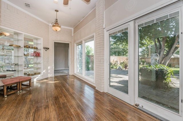 interior space with ceiling fan