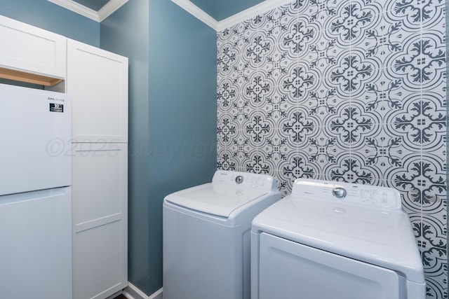 4511 Spartanburg Dr, Amarillo, TX 79119 - laundry room featuring ornamental molding, cabinet space, and independent washer and dryer