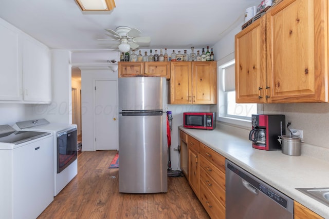 1102 Franklin Ave, Panhandle, TX 79068 - kitchen featuring appliances with stainless steel finishes, washing machine and clothes dryer, light countertops, wood finished floors, and a ceiling fan