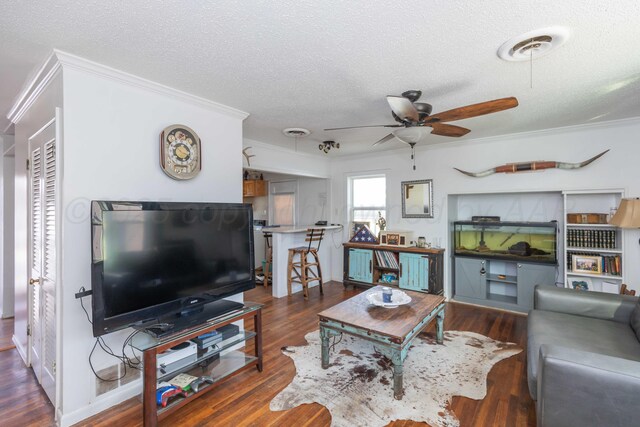 1102 Franklin Ave, Panhandle, TX 79068 - living room with ceiling fan, ornamental molding, a textured ceiling, and wood finished floors