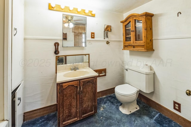 bathroom featuring vanity, ceiling fan, and toilet