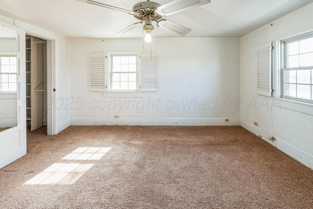 unfurnished bedroom with ceiling fan and carpet