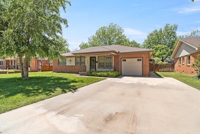 3620 Nebraska St, Amarillo, TX 79109 - view of front facade with an attached garage, brick siding, and driveway