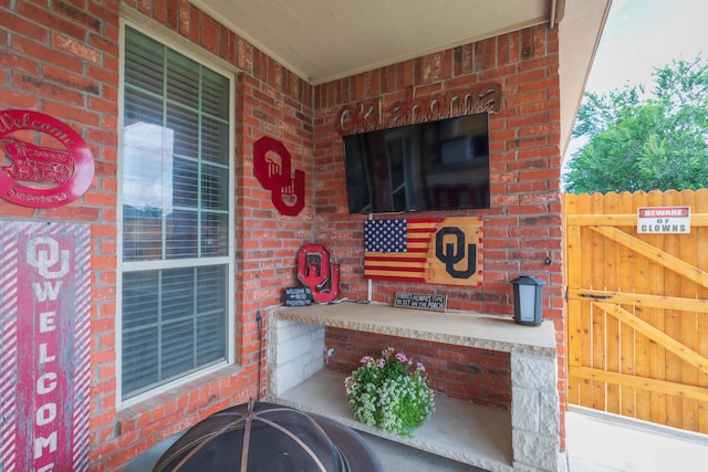 7409 Columbus Dr, Amarillo, TX 79118 - entrance to property with brick siding, a porch, and a gate