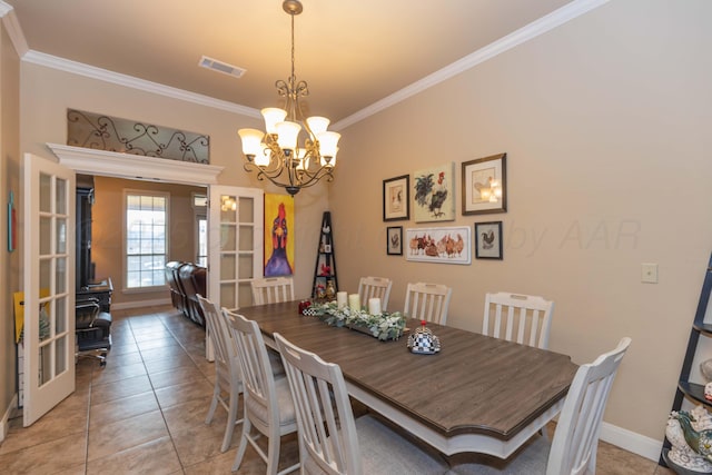 7409 Columbus Dr, Amarillo, TX 79118 - dining space with crown molding, a chandelier, and tile patterned flooring