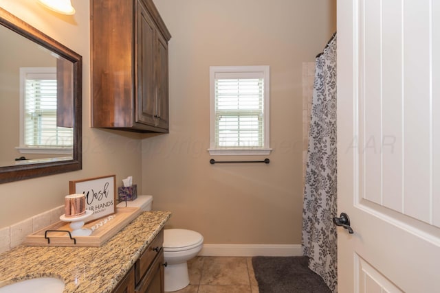 7409 Columbus Dr, Amarillo, TX 79118 - bathroom with tile patterned flooring, double vanity, and curtained shower