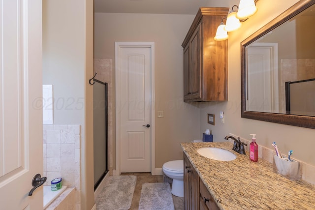 7409 Columbus Dr, Amarillo, TX 79118 - bathroom featuring vanity, a shower stall, tile patterned floors, and tiled bath