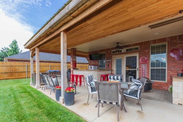 7409 Columbus Dr, Amarillo, TX 79118 - fenced backyard featuring a patio and a ceiling fan