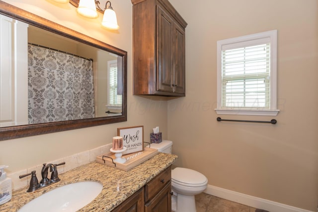 7409 Columbus Dr, Amarillo, TX 79118 - bathroom with plenty of natural light, vanity, and tile patterned floors